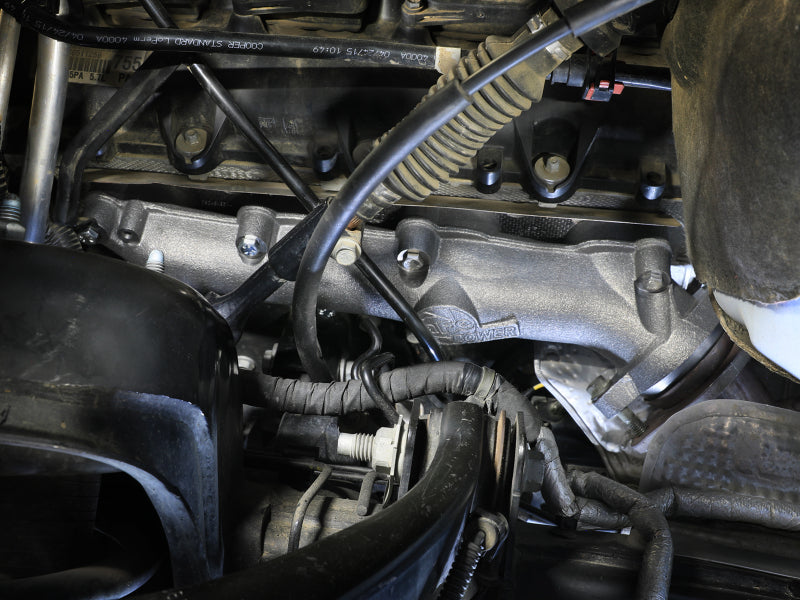 AFE BladeRunner exhaust manifold installed on a Dodge RAM 1500, showcasing its durable design and fit for V8-5.7L HEMI engines.