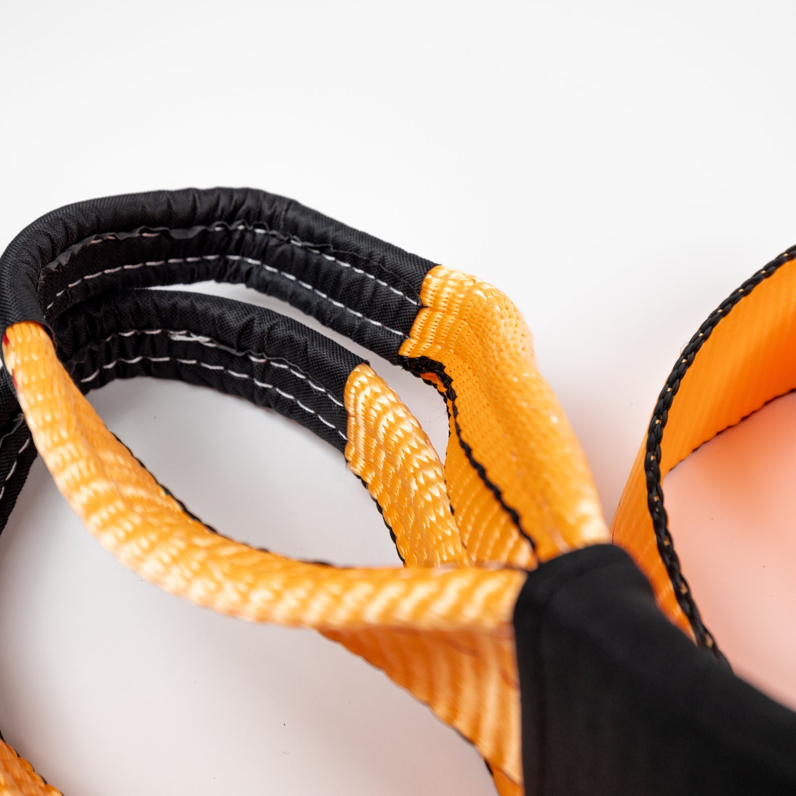Durable 8-foot tree saver strap with reinforced stitching and bright orange color for offroad recovery and protection.