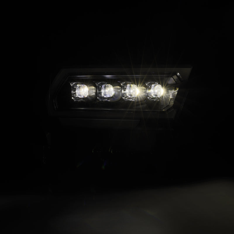 AlphaRex NOVA-Series projector headlights for 2019-2023 Dodge Ram 1500, featuring a sleek black design and bright illumination.