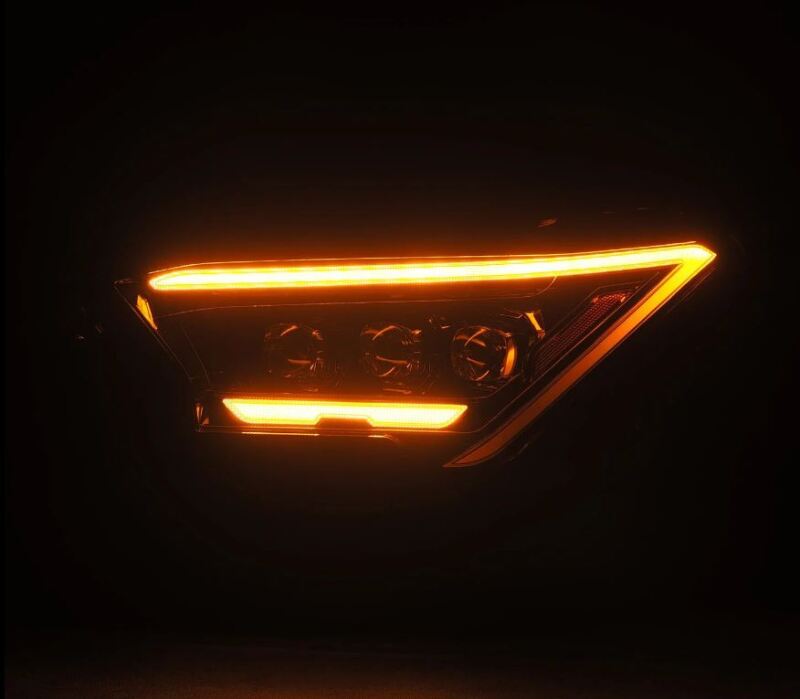 AlphaRex 2024 Toyota Tacoma NOVA-Series projector headlights in alpha-black with activation light, showcasing a sleek design.