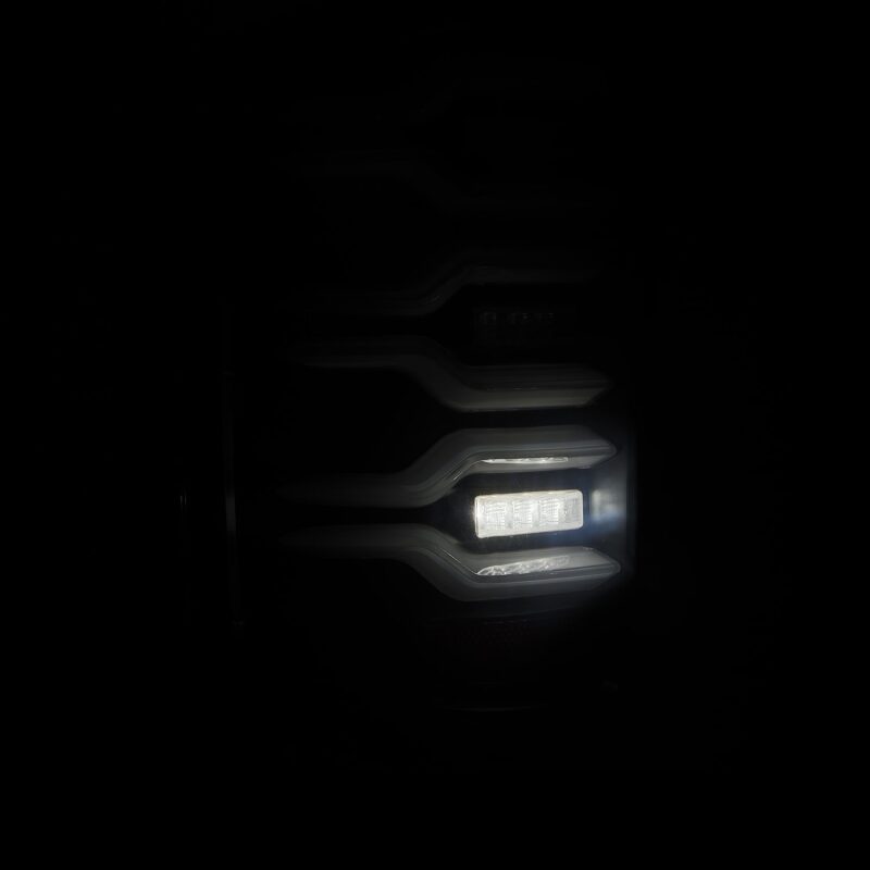 AlphaRex Luxx-Series LED tail lights for 14-18 Chevrolet Silverado featuring a sleek black design with sequential signals.