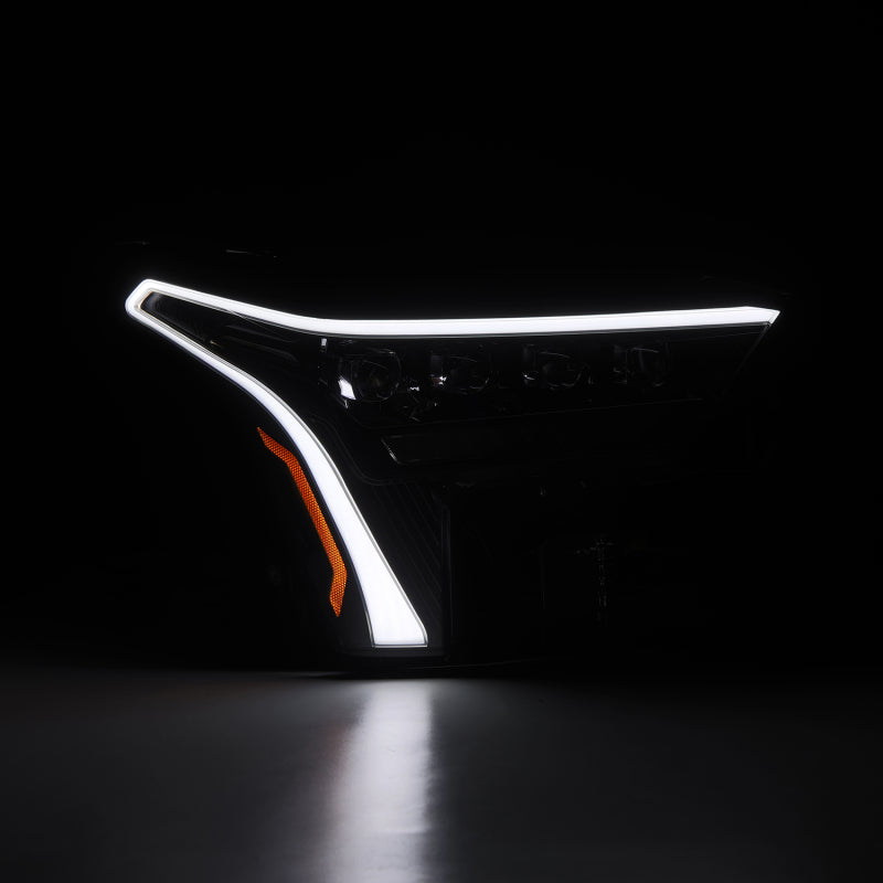 AlphaRex NOVA-Series headlights for 22-23 Toyota Tundra in alpha-black with amber DRL, showcasing sleek design and modern lighting.