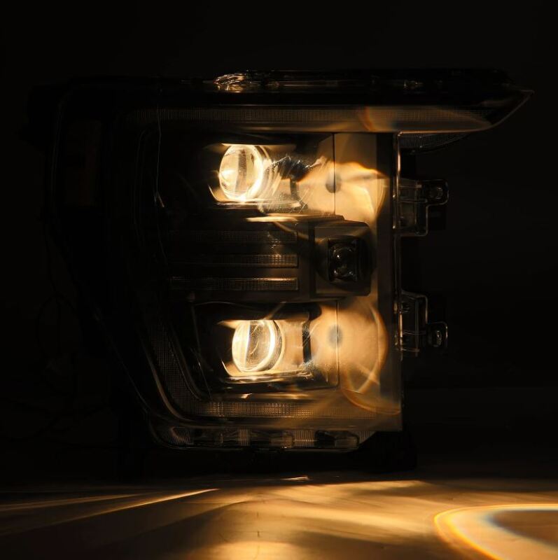 AlphaRex PRO-Series projector headlights for 21-22 Ford F150 in black with active lighting and sequential signals.