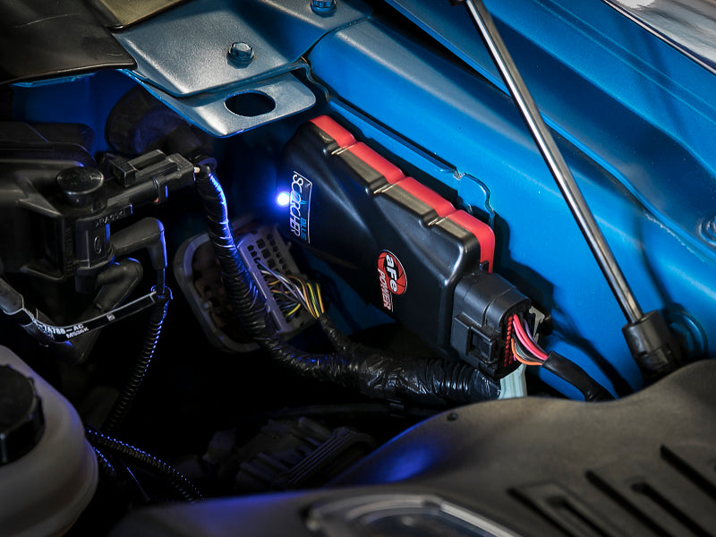 AFE SCORCHER Power Module installed in a Ford F-150 engine bay, enhancing performance for the 2015-2016 V6-3.5L model.