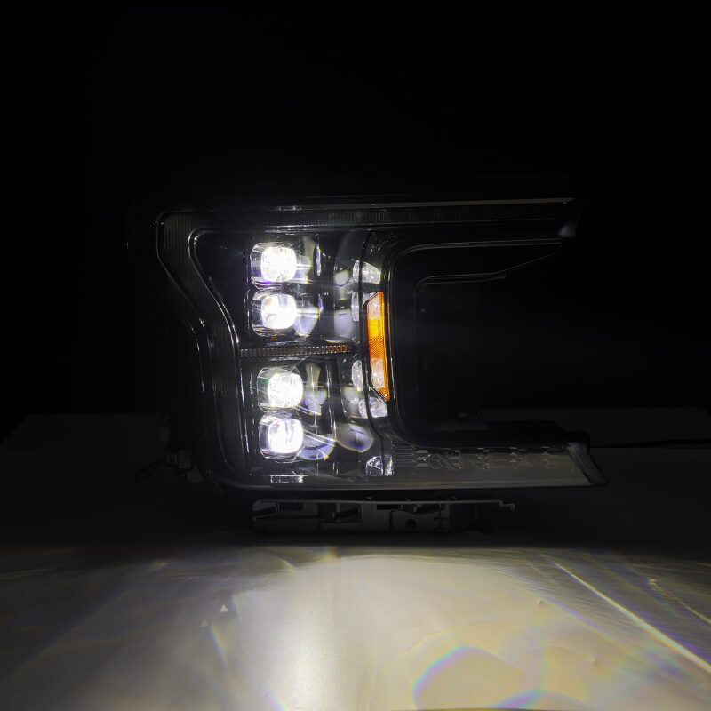 AlphaRex NOVA LED projector headlight for 2018-2020 Ford F-150, featuring a sleek black design and advanced lighting technology.
