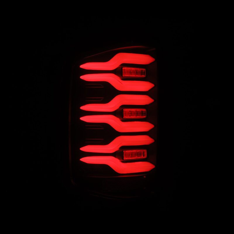 AlphaRex Luxx-Series LED tail lights for 14-18 Chevrolet Silverado featuring a sleek black design with sequential signals.