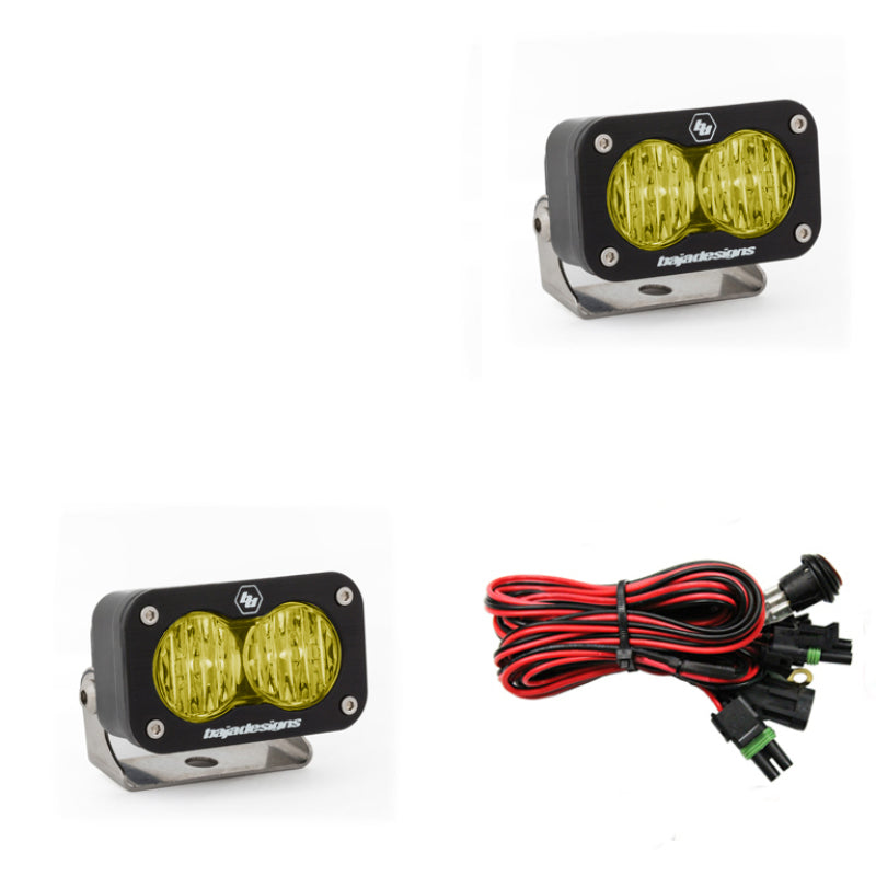 Baja Designs S2 Sport amber LED work lights with wide cornering pattern and wiring harness for offroad vehicles.