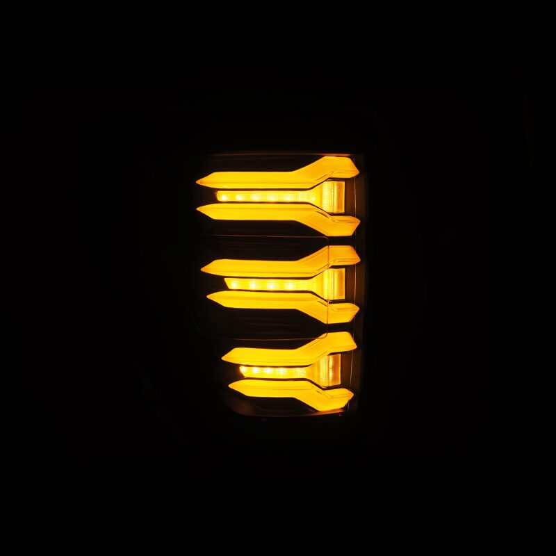 AlphaRex LUXX LED taillights for 2021-2022 Ford F-150, featuring a sleek design with bright amber lighting.
