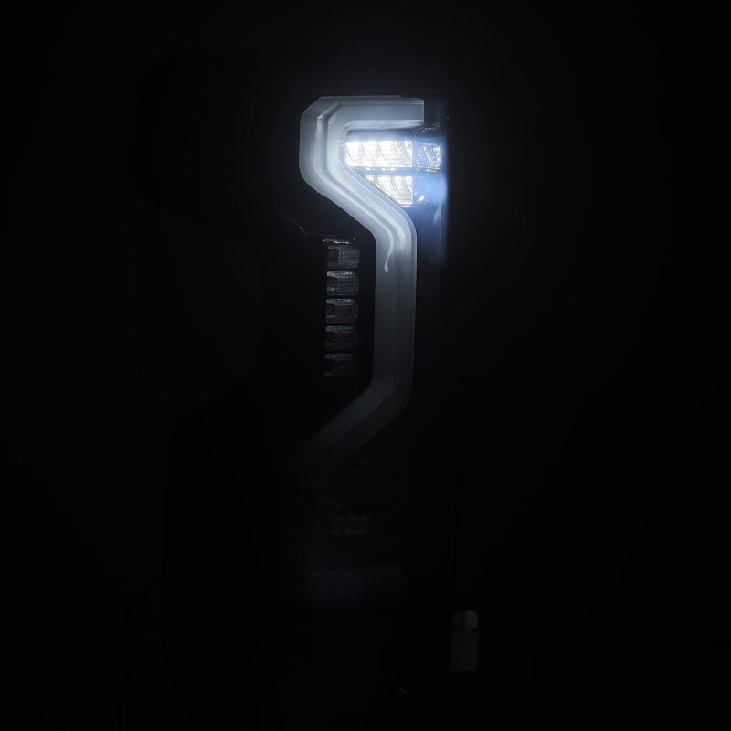 AlphaRex PRO-Series LED tail light for 2019-2023 Chevrolet Silverado models in jet black finish, showcasing modern design and bright illumination.