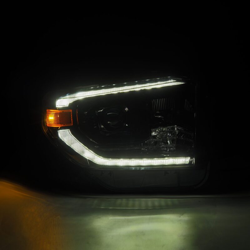 AlphaRex LUXX-Series LED projector headlights for 14-21 Toyota Tundra with active light, sequential signal, and DRL.