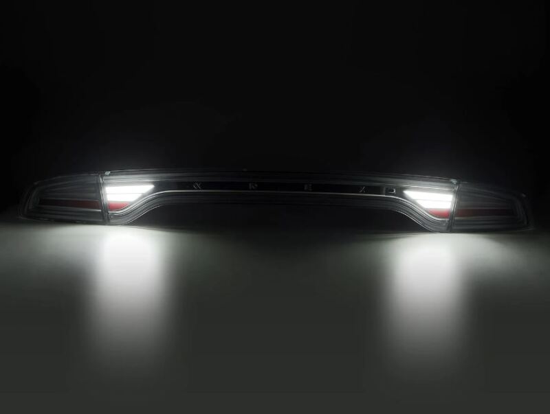 AlphaRex NOVA-Series prismatic LED tail lights for 2015-2023 Dodge Charger in black, showcasing bright illumination.