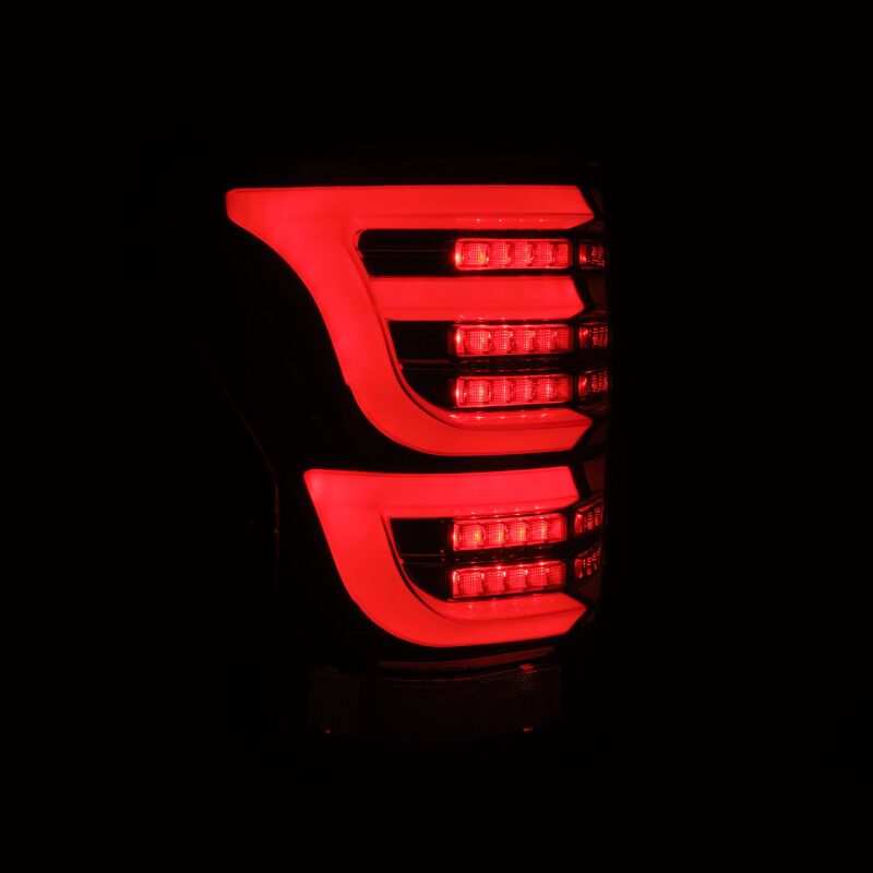 AlphaRex LUXX-Series LED tail lights for 07-13 Toyota Tundra in alpha-black, featuring a sleek modern design and bright illumination.