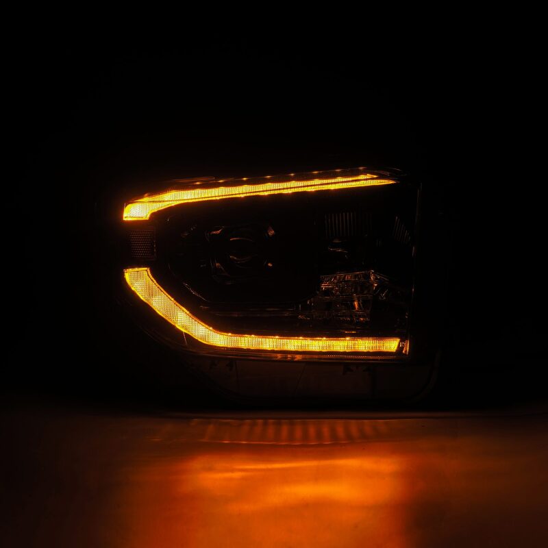 AlphaRex 14-21 Toyota Tundra PRO-Series black projector headlights with sequential signal and daytime running lights.