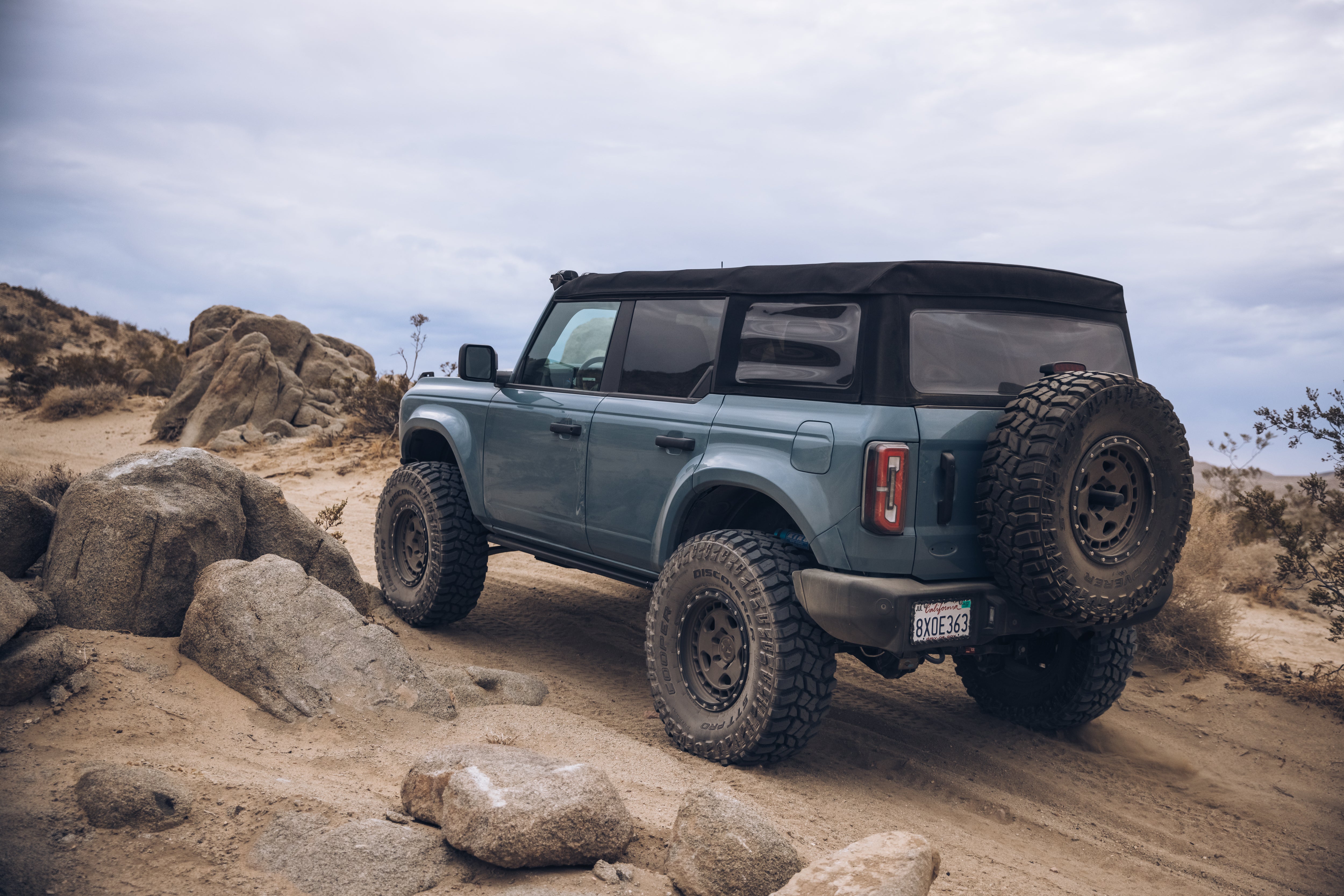 ADV Fiberglass 2021 Ford Bronco parked on rocky terrain, showcasing its rugged off-road capabilities and custom features.
