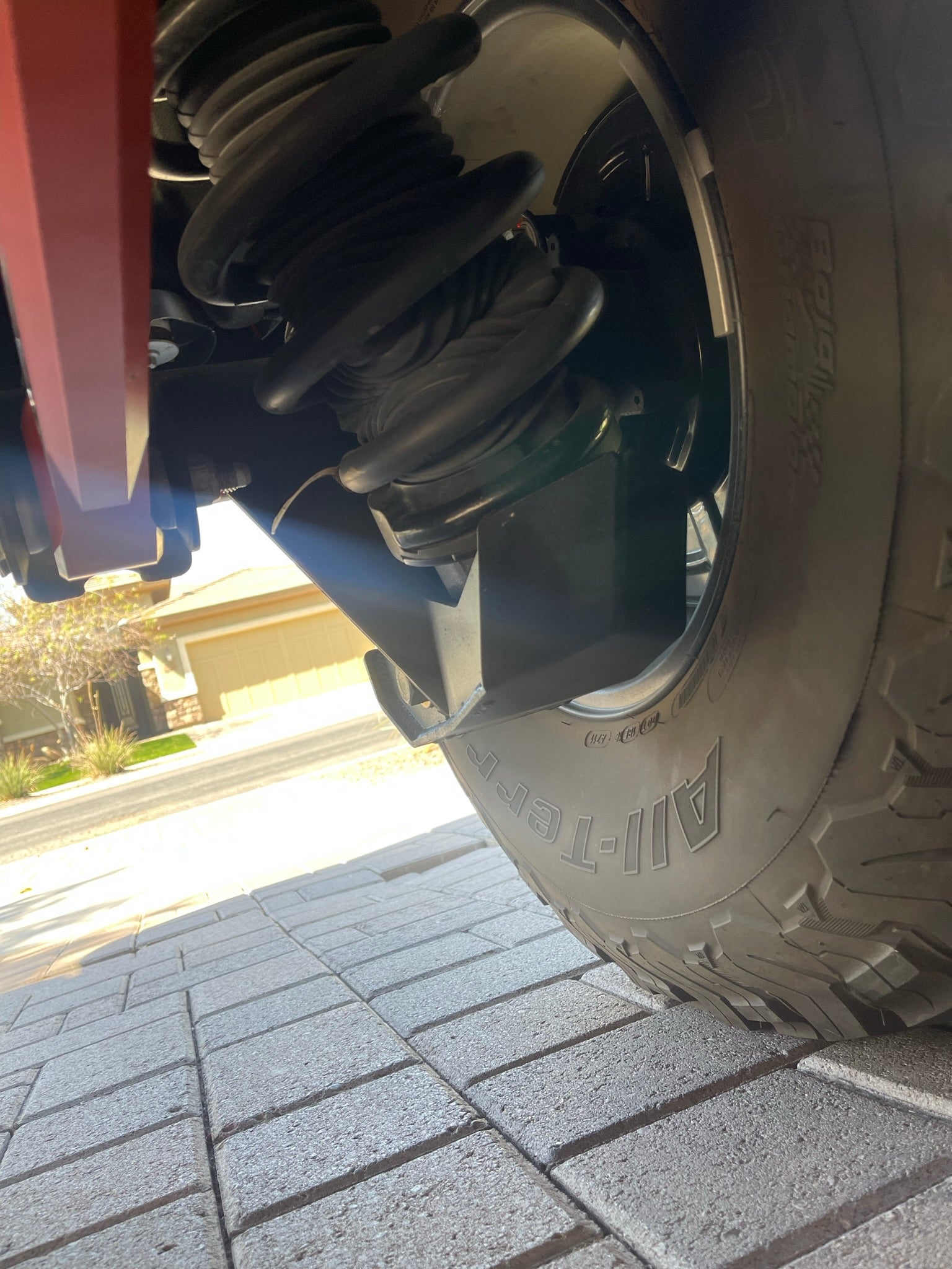 Rear view of a 2022 Bronco Raptor showcasing a rear shock skid kit, enhancing off-road protection and durability.
