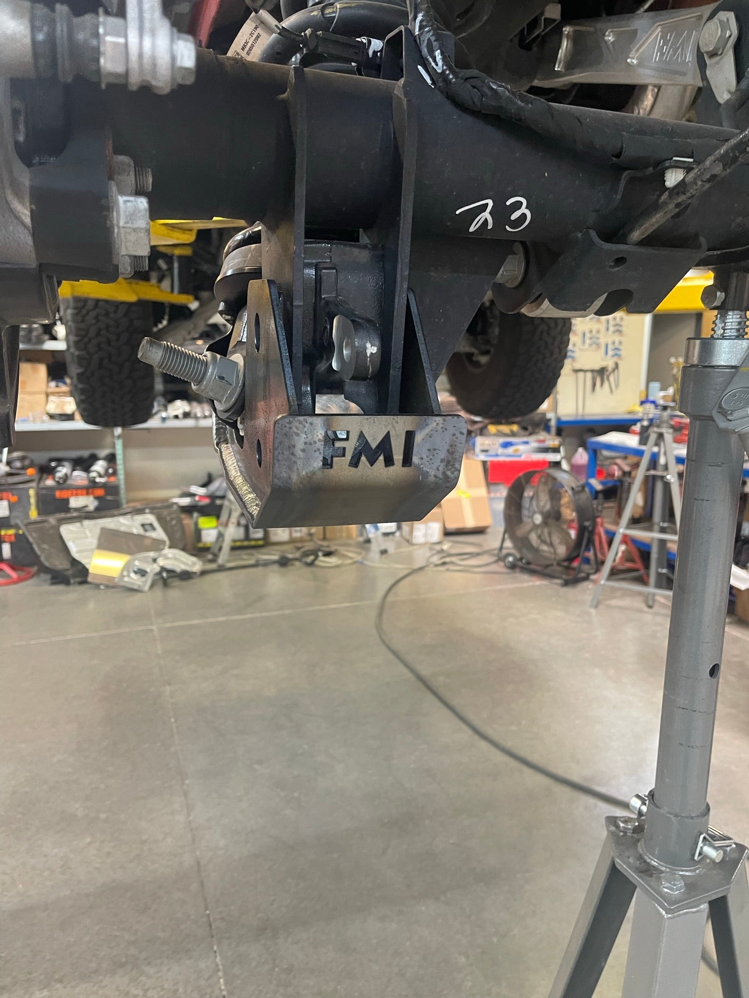 2022 and up Bronco Raptor rear shock skid kit mounted on a vehicle's suspension for enhanced protection and performance.