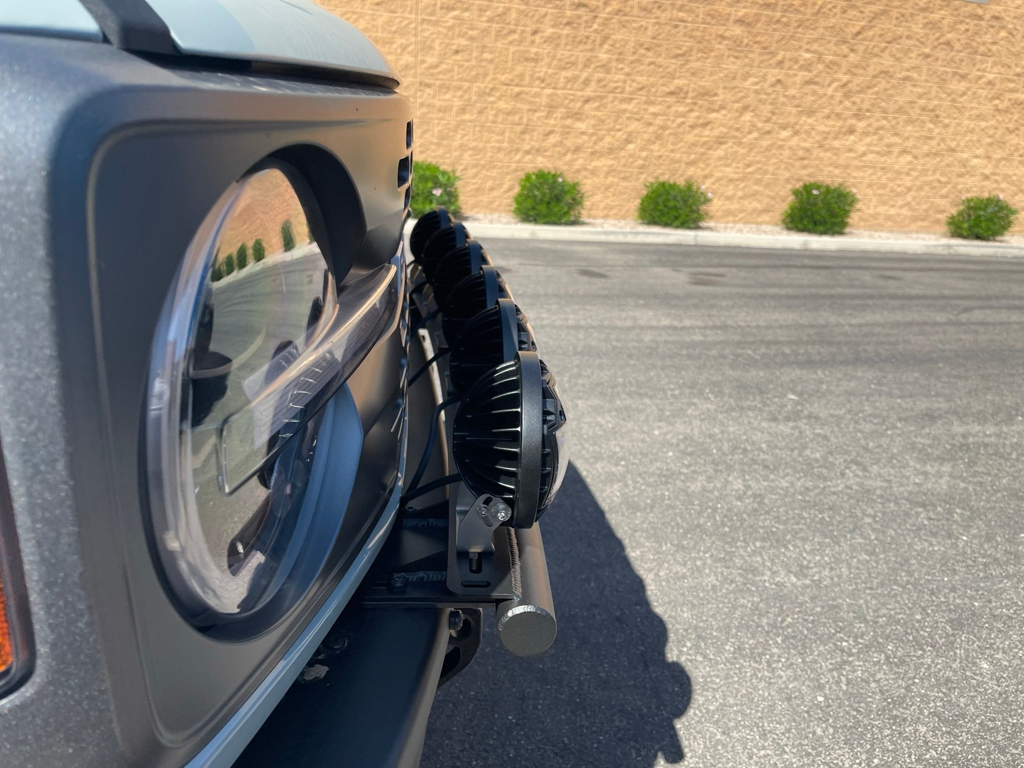 Front view of a 2022-UP Bronco Raptor with a light mount kit, showcasing adjustable light placement options.