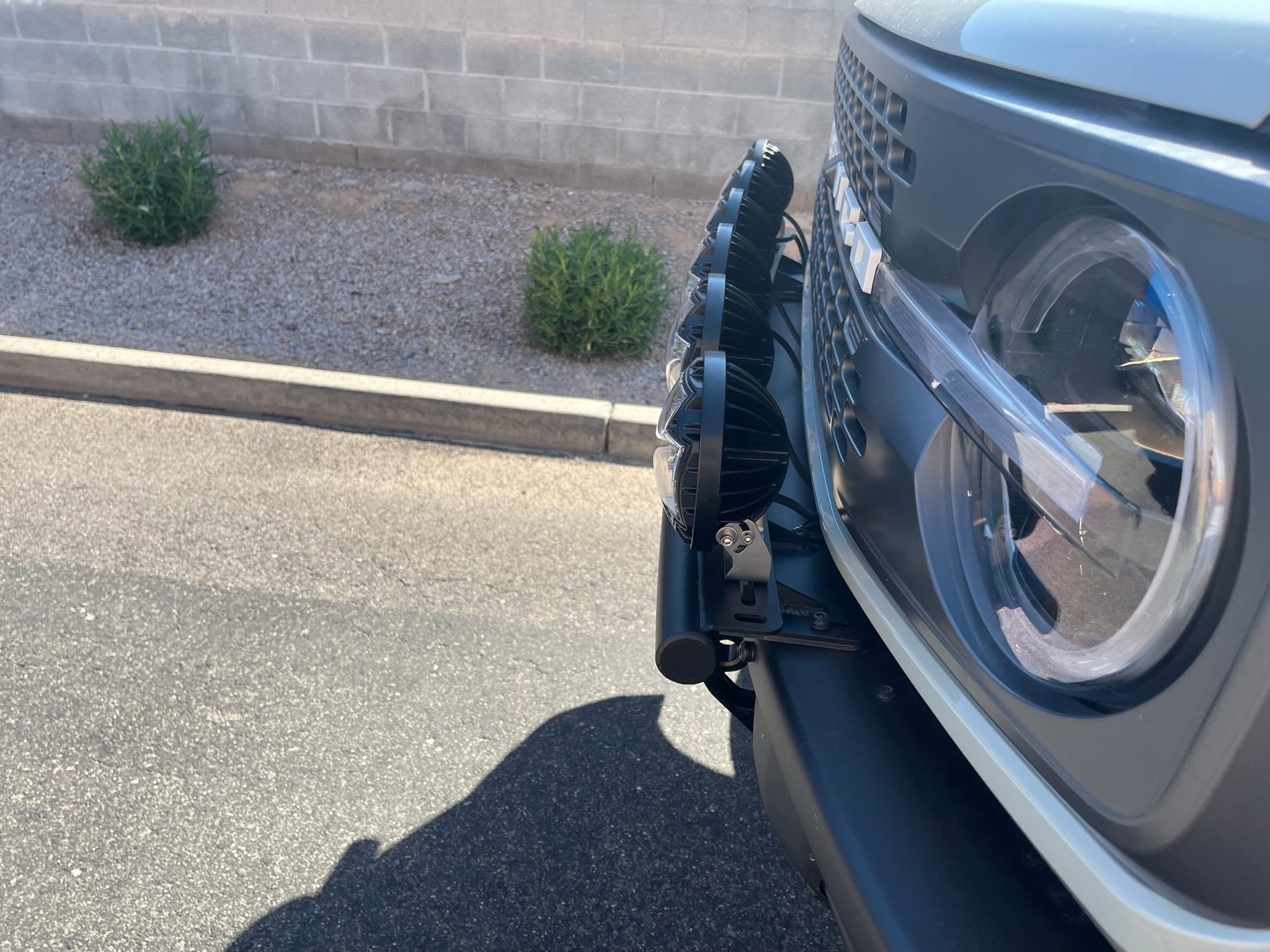 2022-UP Bronco Raptor front light mount kit showcasing versatile light attachment on vehicle front.