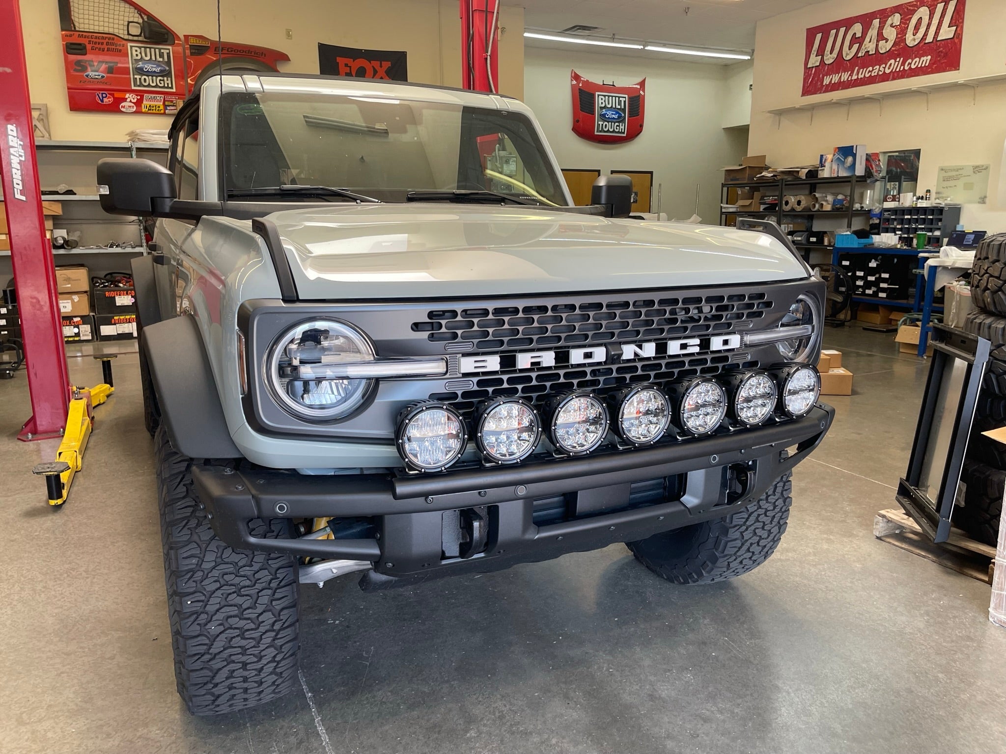 6th Gen Bronco Front Light Mount Kit installed on a modular stock front bumper, showcasing multiple lights for offroad use.