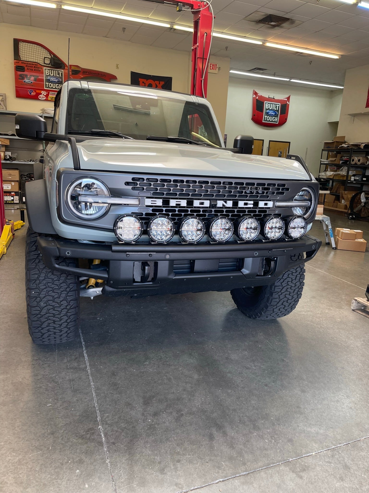 6th Gen Bronco Front Light Mount Kit installed on a modular stock front bumper, showcasing multiple mounted lights.