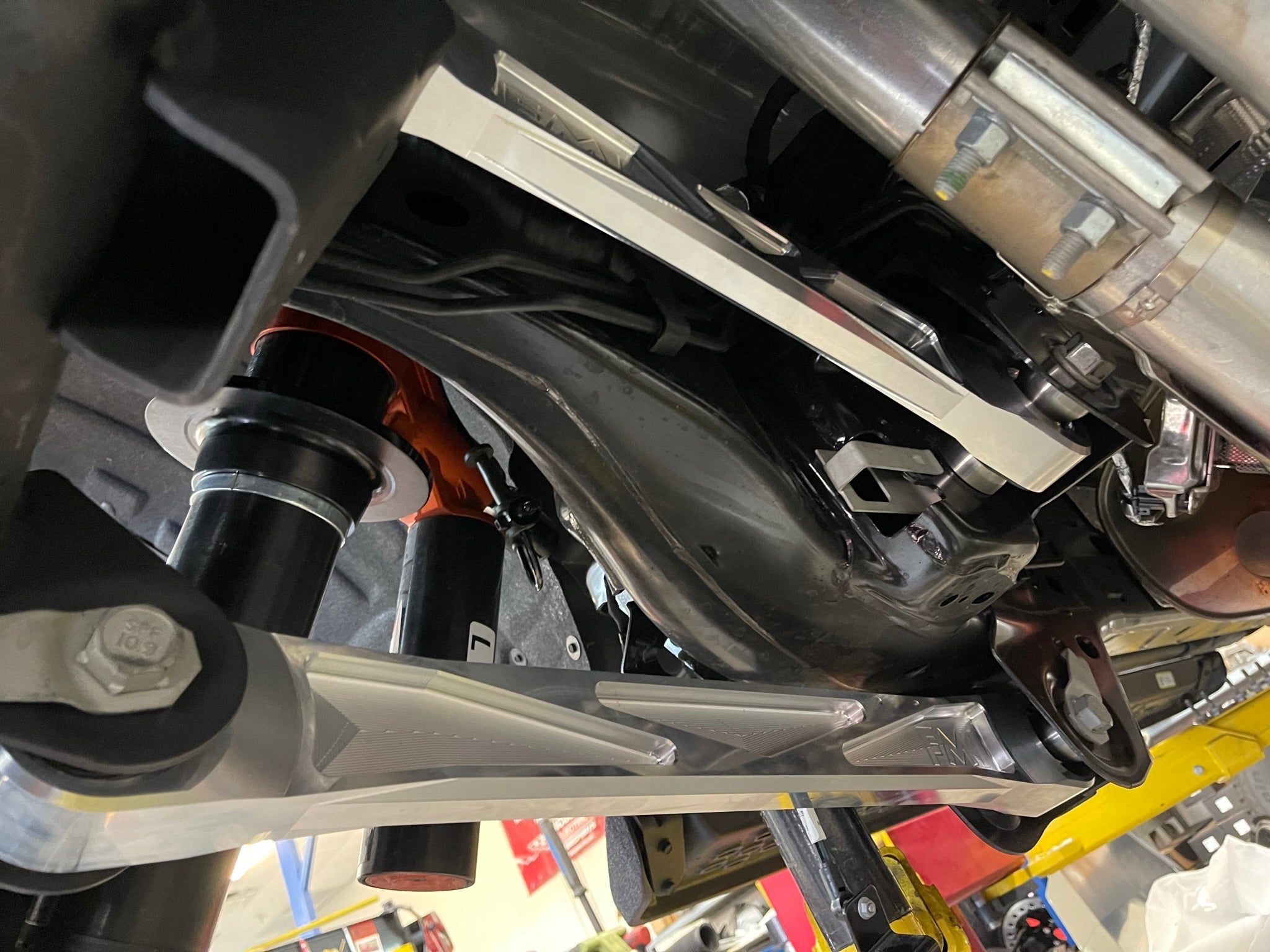 Bronco Raptor billet aluminum rear suspension upper arms installed, showcasing durability and precision engineering.