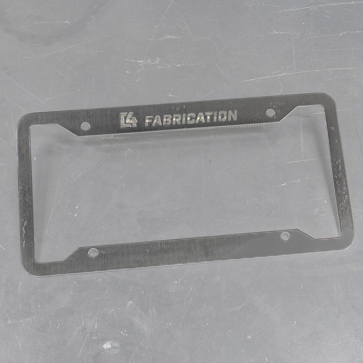 C4 License Plate Frame featuring a durable design with engraved branding for a stylish automotive accessory.