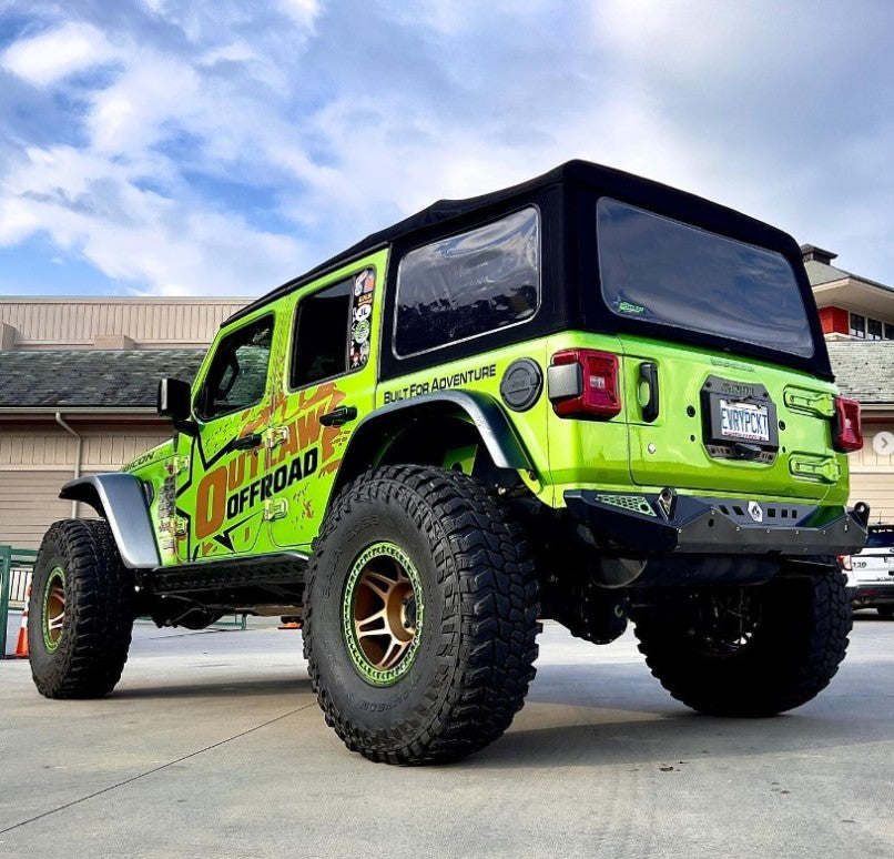 Blaze Rear Bumper for Jeep Wrangler JL showcased on a modified green Jeep with oversized tires and offroad graphics.