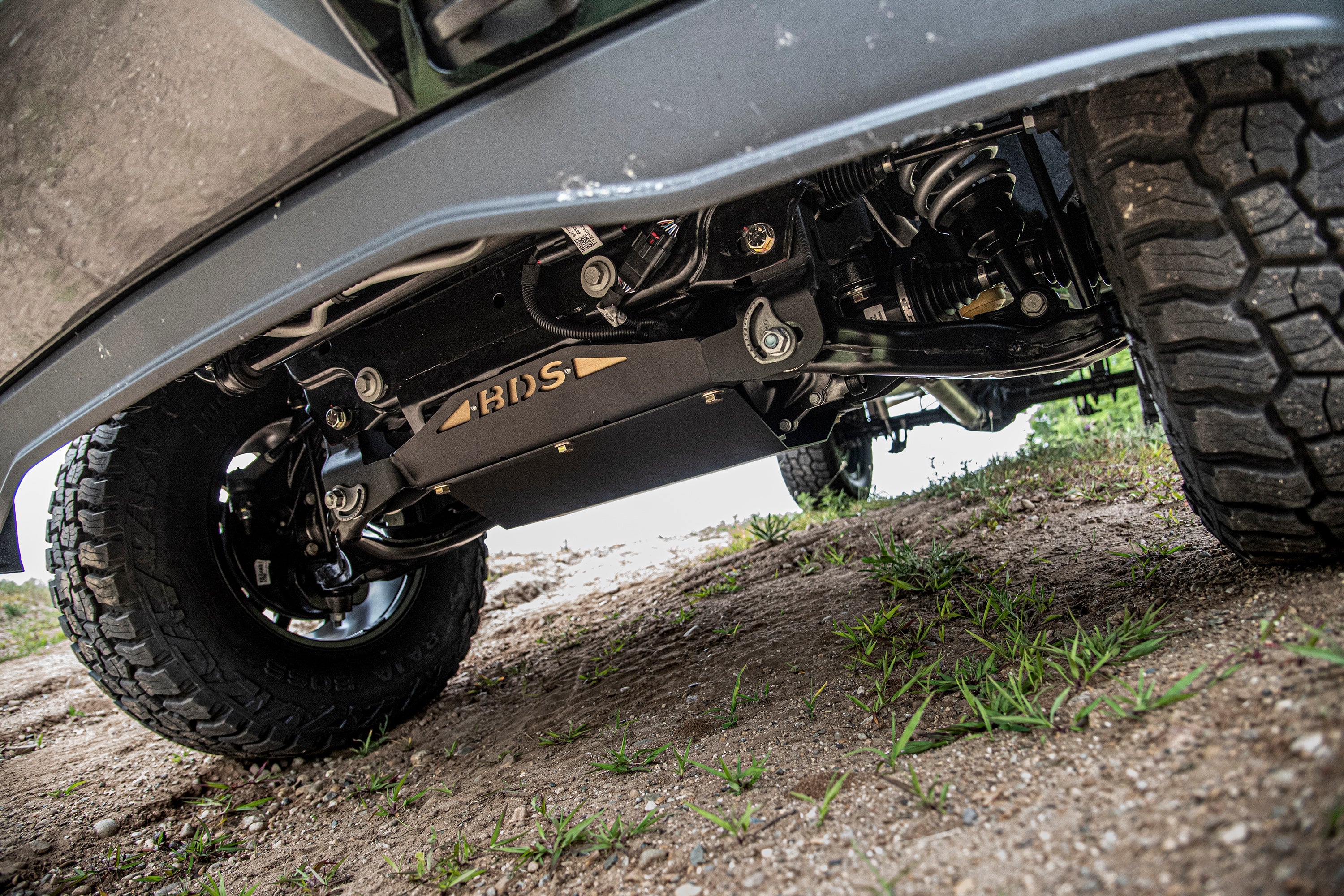 5.5 inch lift kit installed on a Chevy Colorado or GMC Canyon, showcasing undercarriage components and rugged tires.