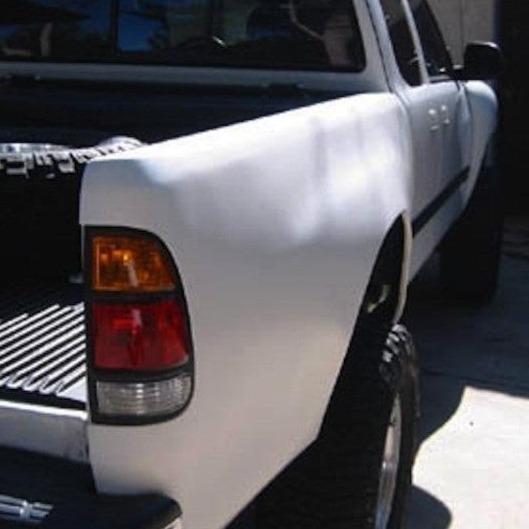2000-2006 Toyota Tundra bedsides showcasing a clean, white finish and integrated taillight for truck customization.