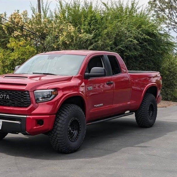 2014-2021 Toyota Tundra with custom bedsides, showcasing a rugged offroad design and enhanced tire clearance.