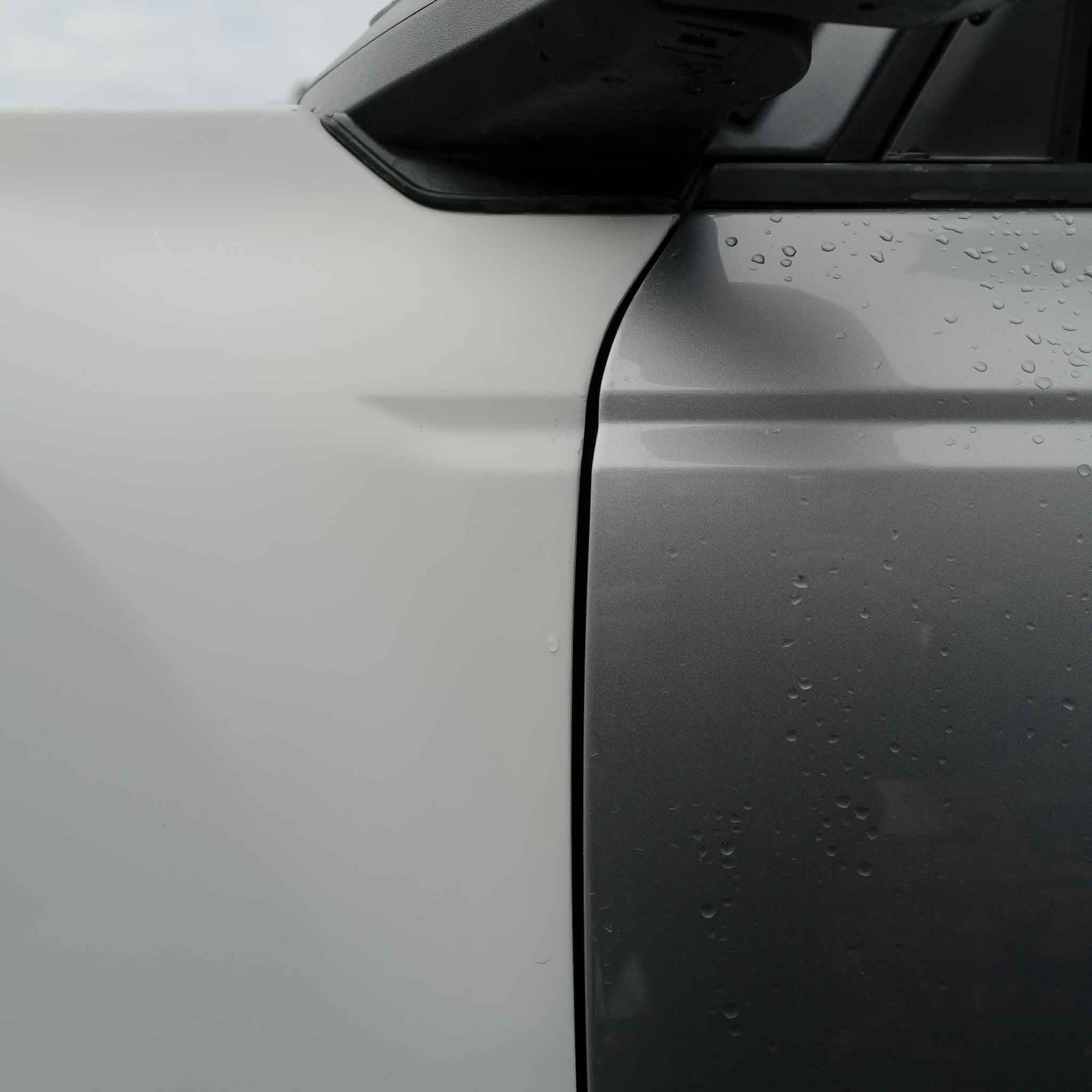 2022-2025 Ford Bronco Raptor fenders showcasing a sleek design with a smooth finish and water droplets on the surface.