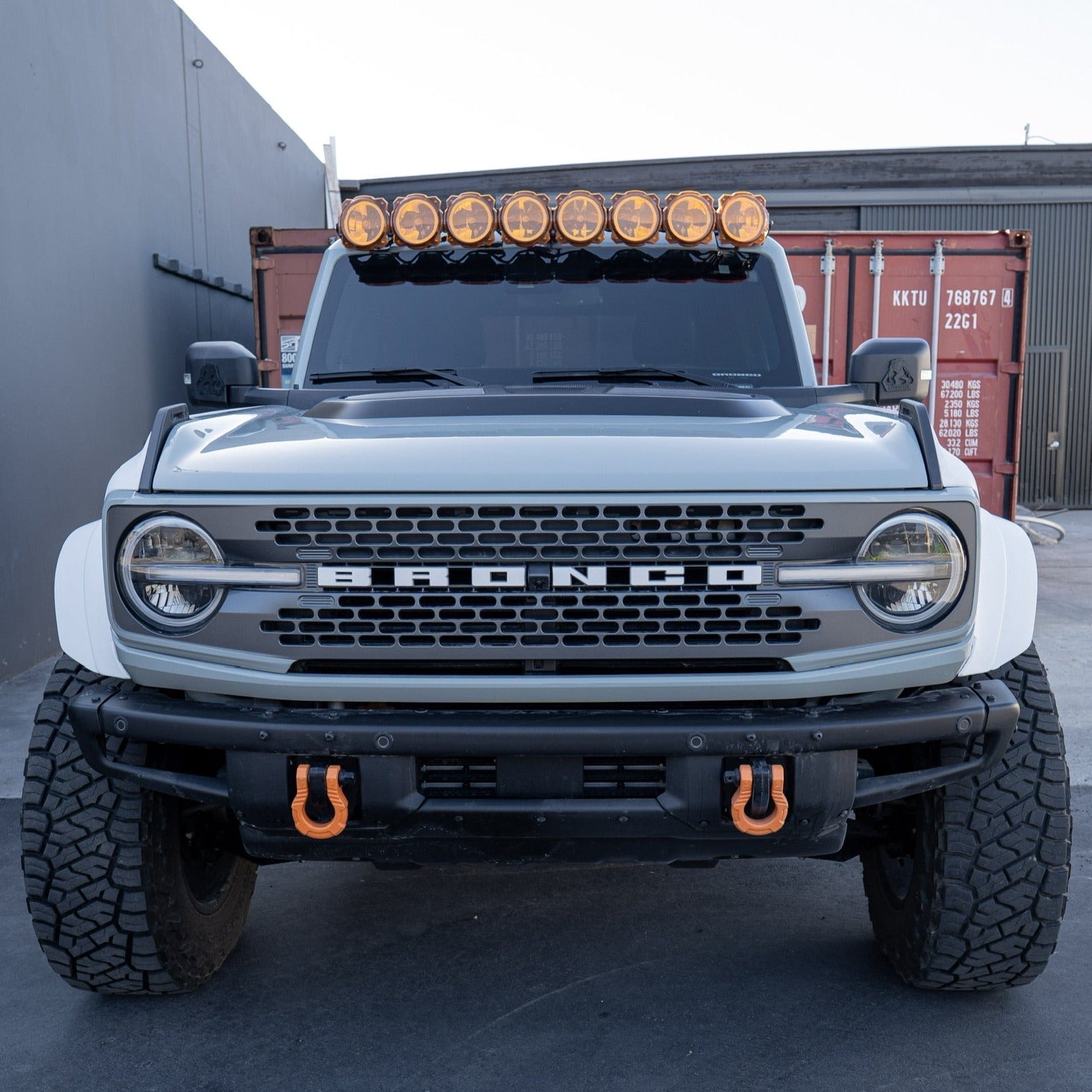 2021-2025 Ford Bronco fenders displayed on a modified Bronco with off-road lights and rugged tires.