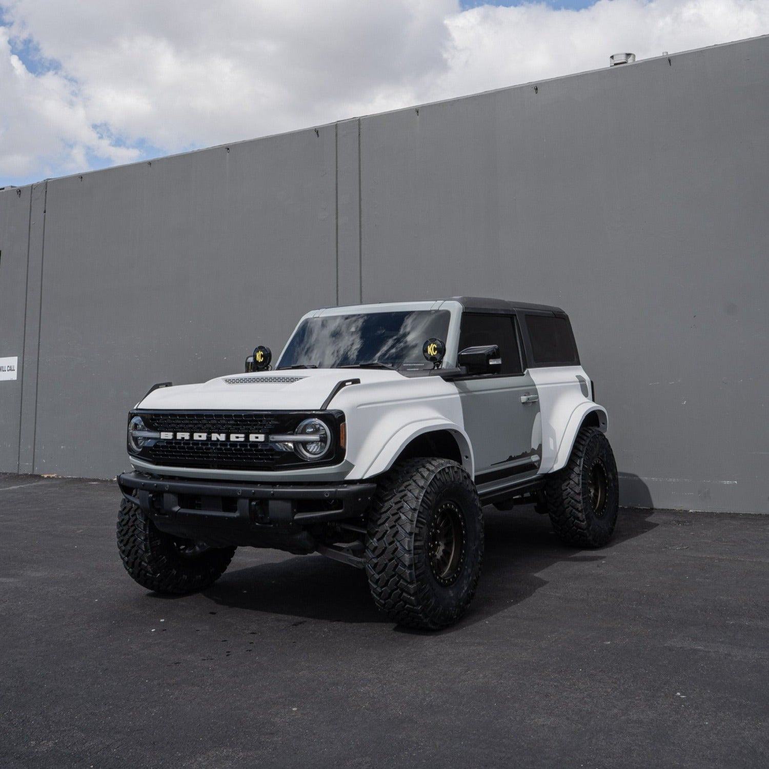 2021-2025 Ford Bronco 2-Door Rear Quarter Kit displayed on a modified white Bronco with off-road tires and accessories.