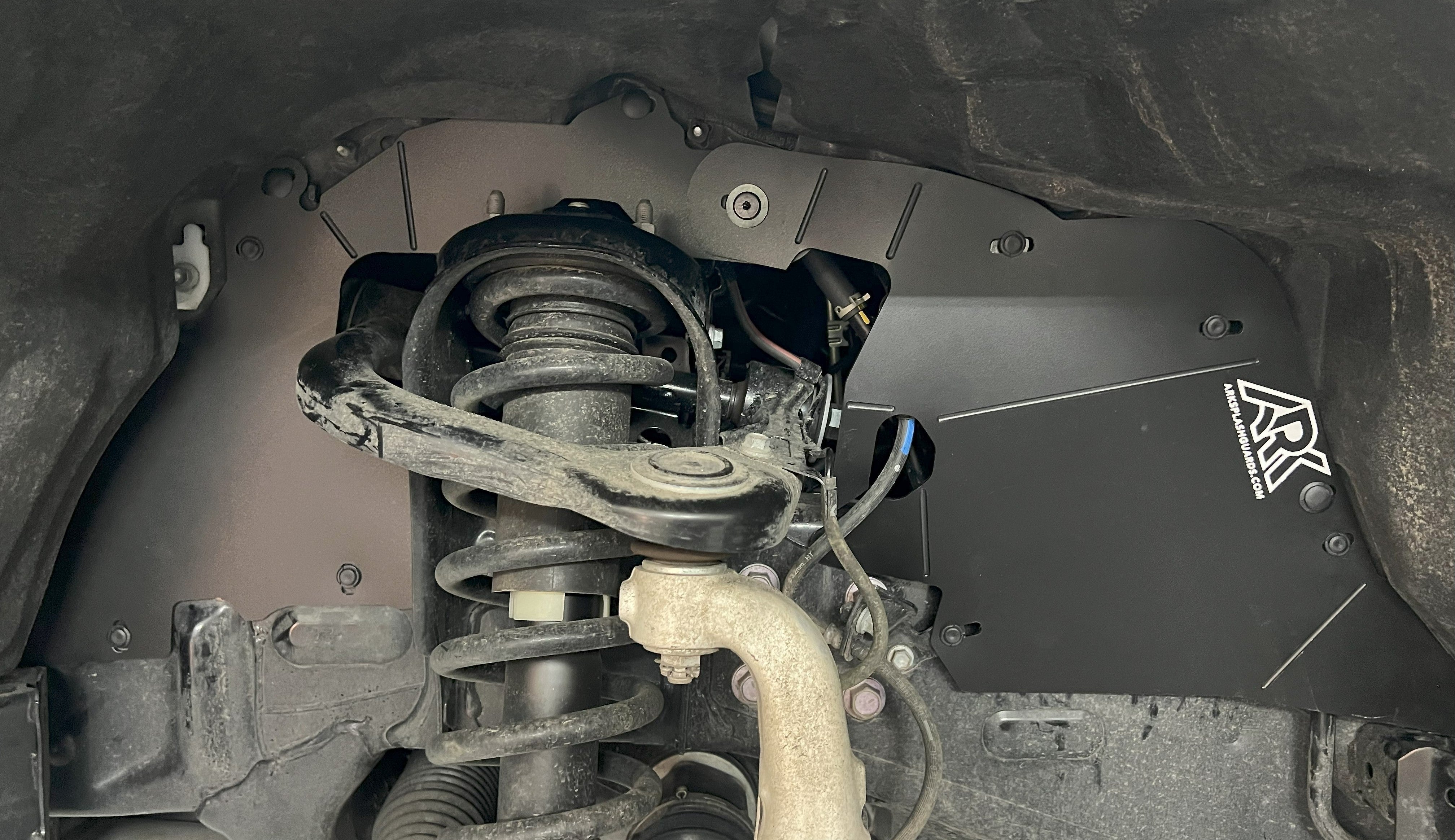 2025+ Toyota 4Runner TriXpoly splash guards installed, showcasing protection against mud and debris in the wheel well.
