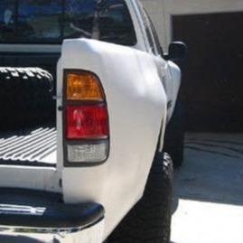 2000-2006 Toyota Tundra bedsides showcasing a clean, white finish and integrated taillights for truck customization.