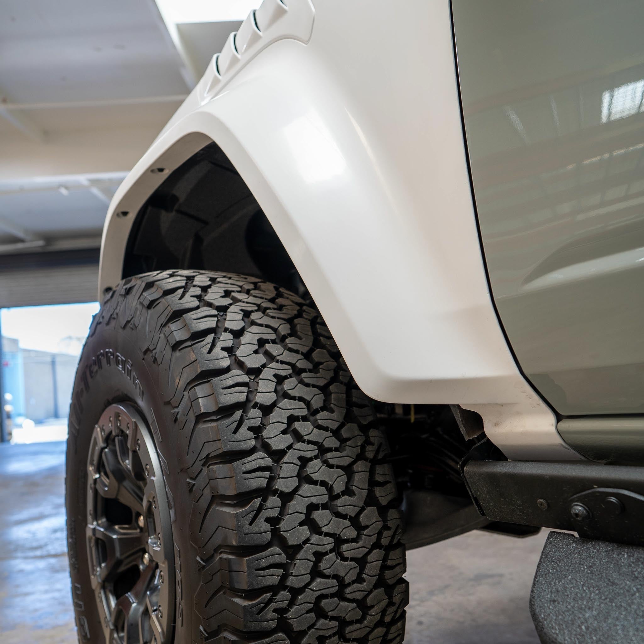 2022-2025 Ford Bronco Raptor fenders showcasing a rugged design and durable construction with off-road tires.