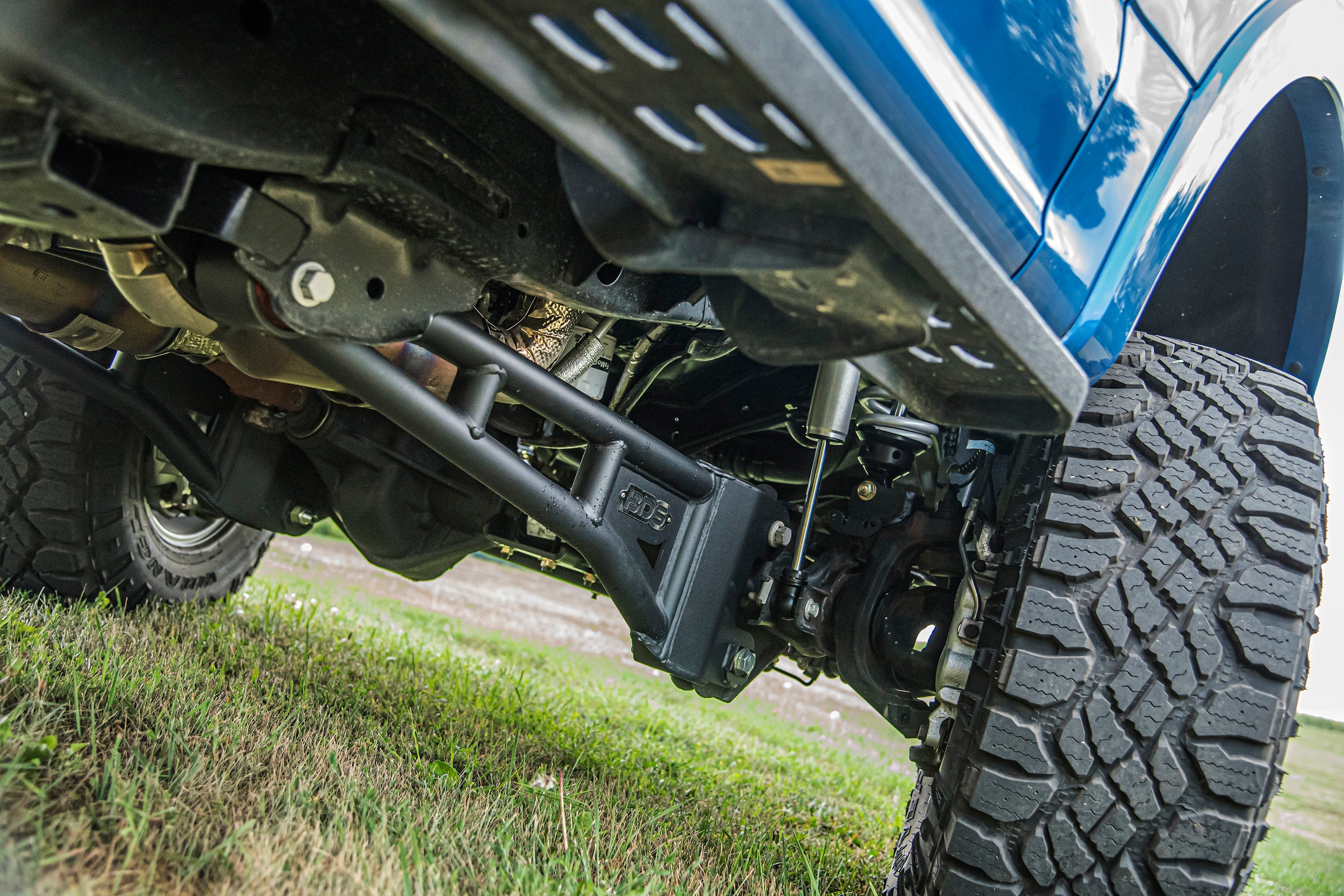 3 inch lift kit with radius arm and FOX 2.5 coil-over conversion installed on a Ford F250/F350 Super Duty 4WD.