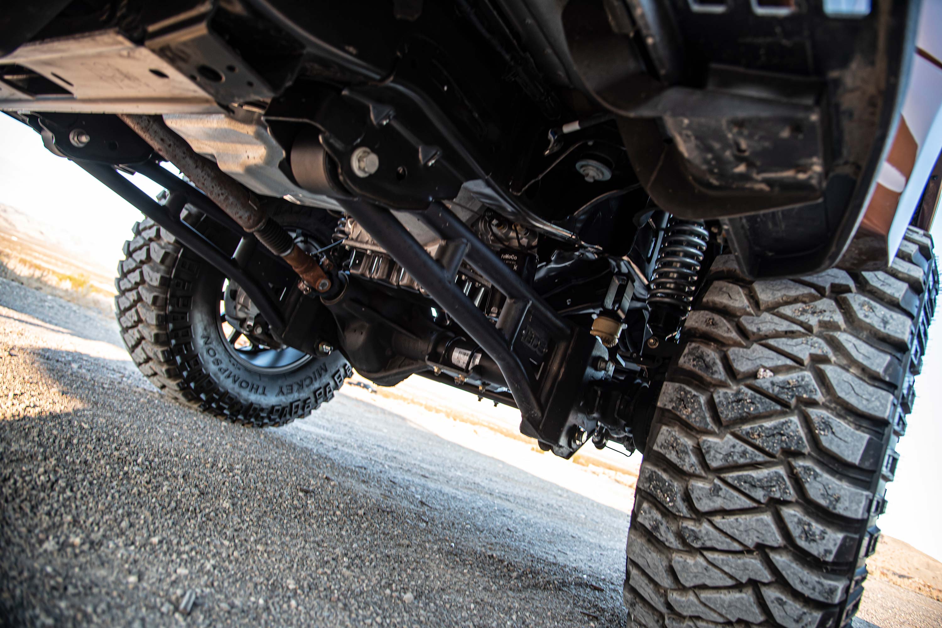 5-inch lift kit with radius arm installed on a Ford F250/F350 Super Duty, showcasing undercarriage and suspension components.