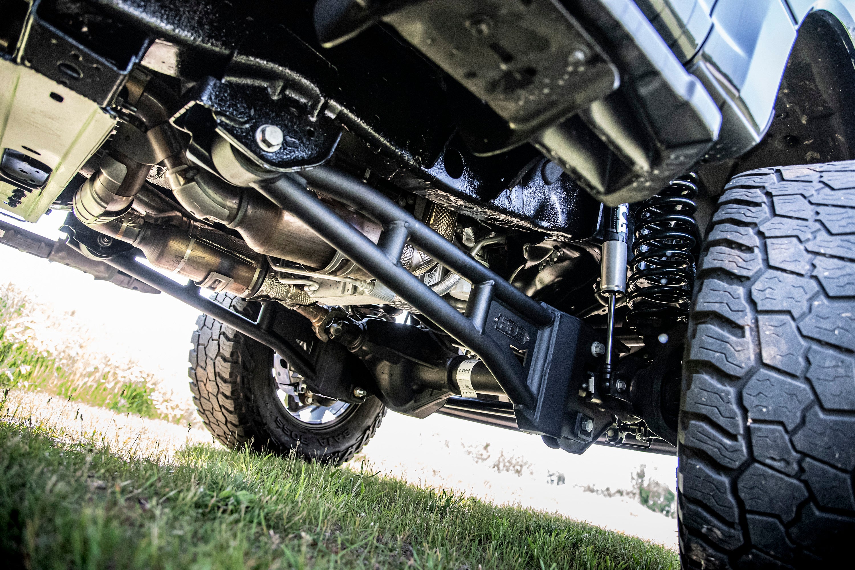 3-inch lift kit with radius arm for Ford F250/F350 Super Duty 4WD, showcasing undercarriage components and suspension.