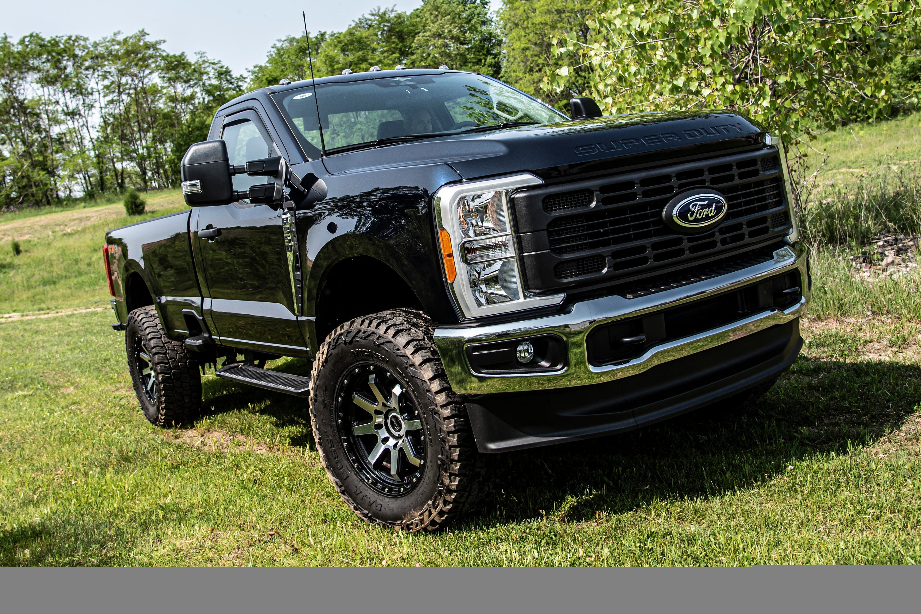 3-inch lift kit with radius arm and FOX 2.5 coil-over conversion installed on a Ford F250/F350 Super Duty 4WD.