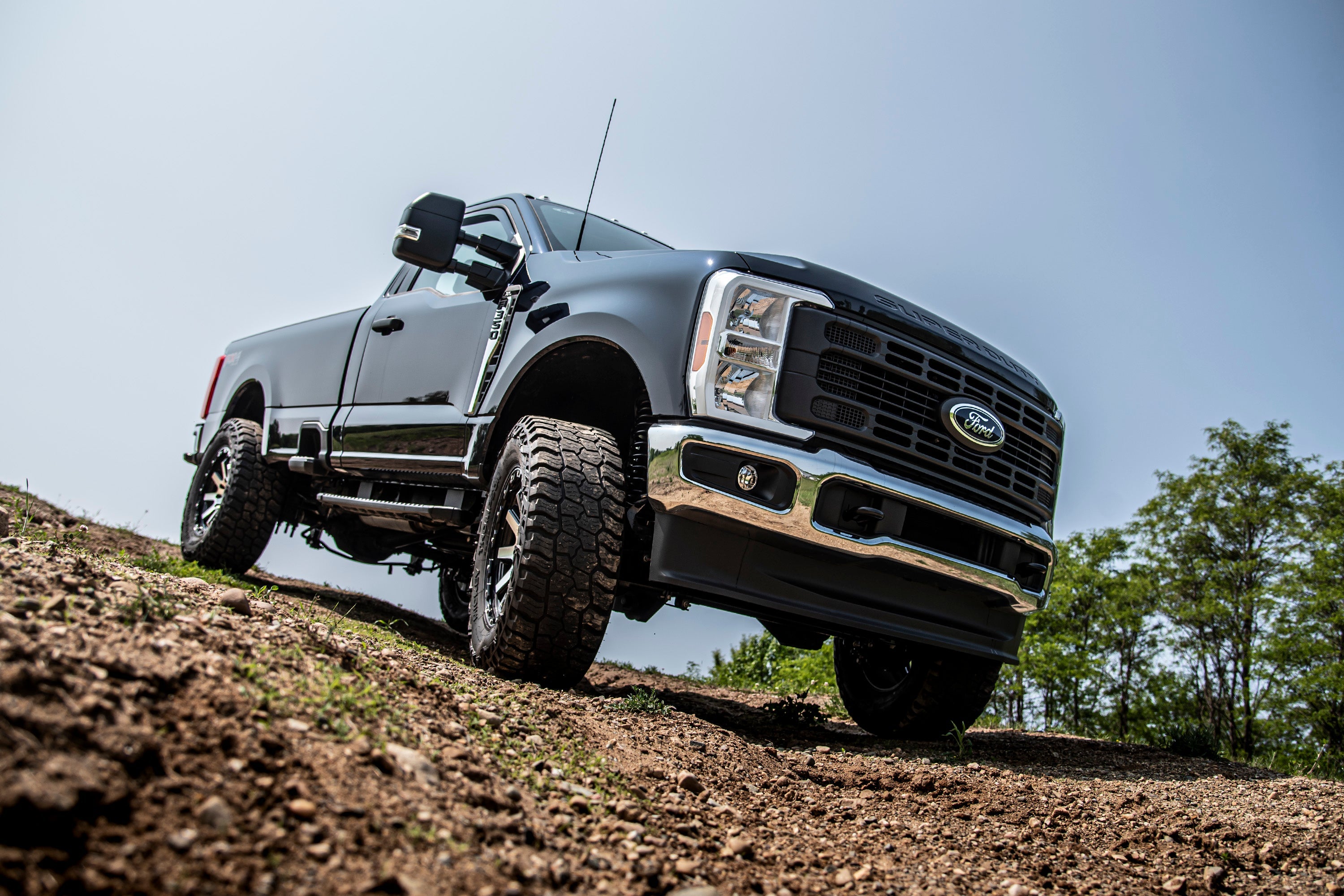3-inch lift kit with FOX 2.5 coil-over conversion installed on a Ford F250/F350 Super Duty, showcasing off-road capability.