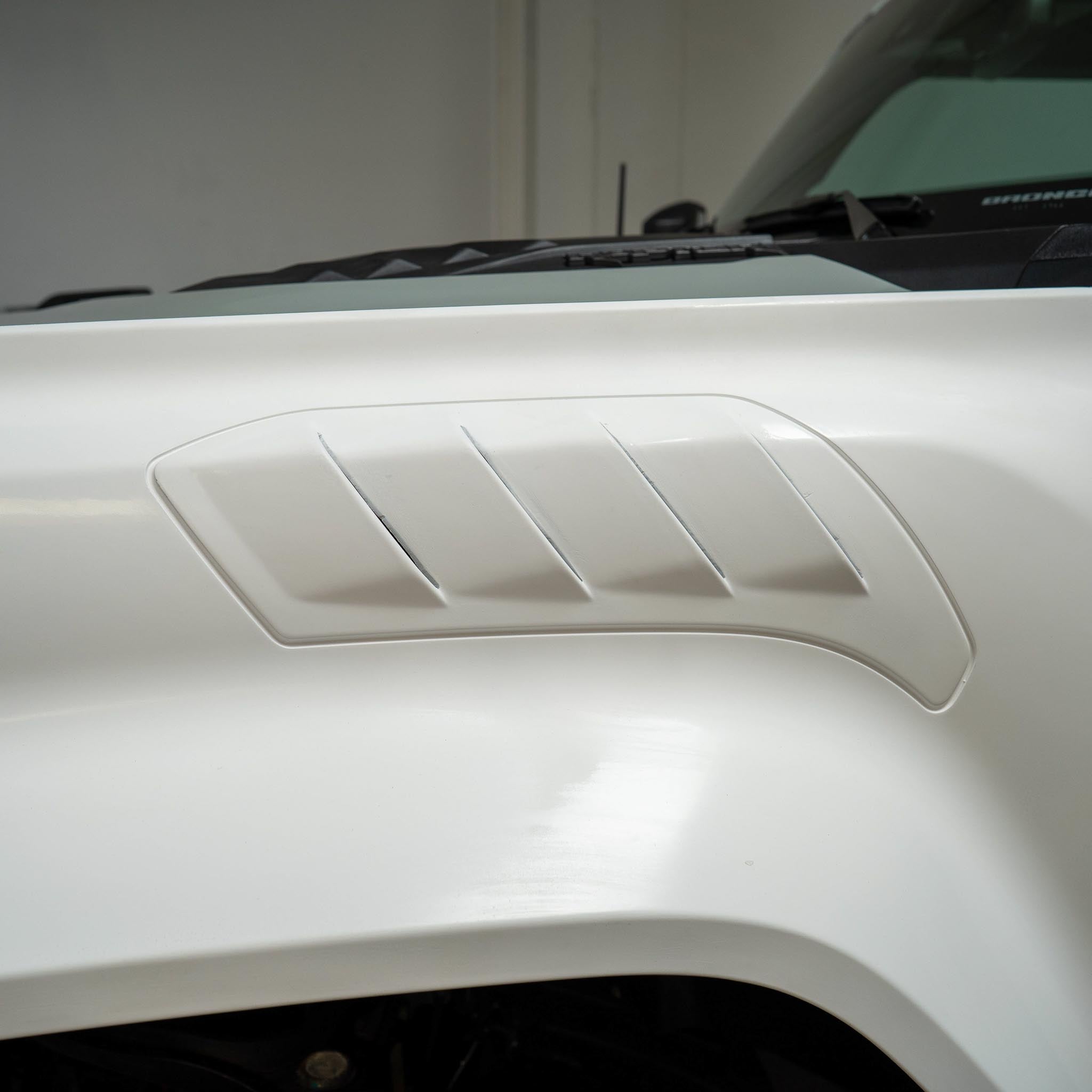 2022-2025 Ford Bronco Raptor fender showcasing a sleek design with vent accents for enhanced performance and style.