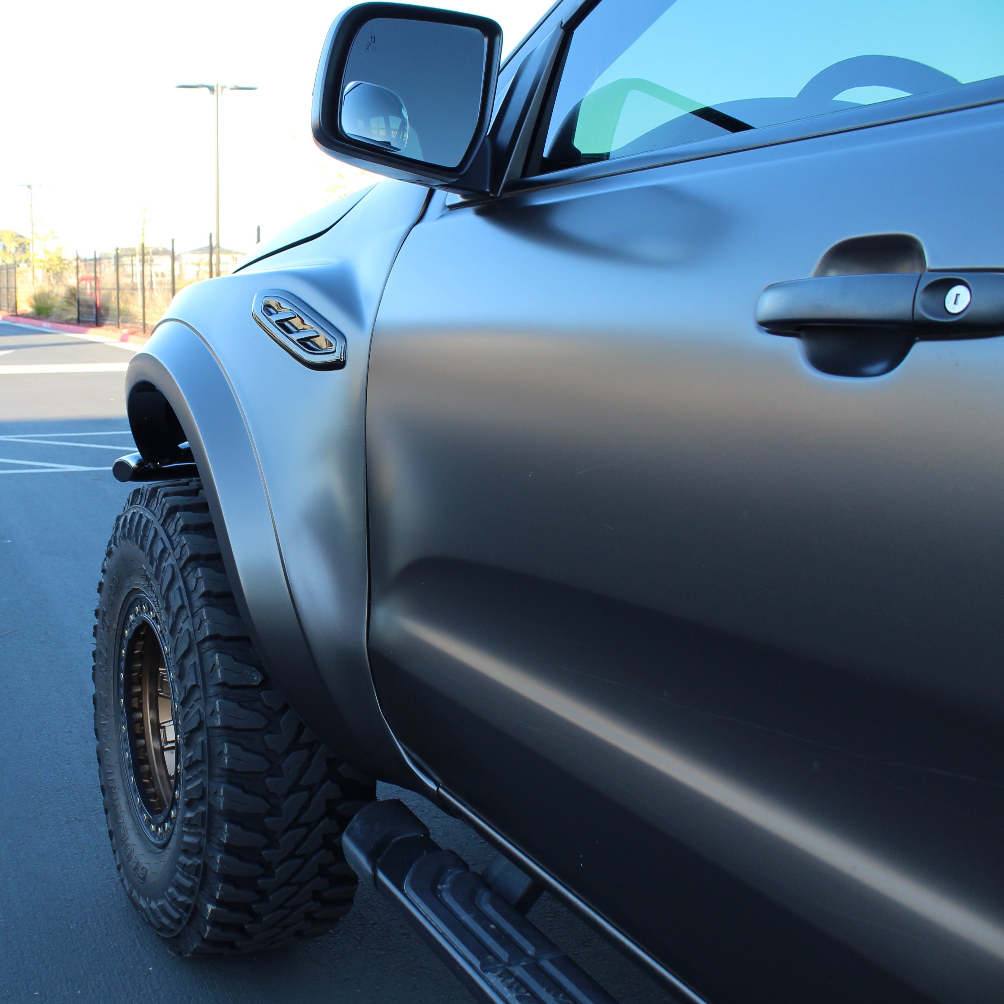 Matte black fender on a 2019-2023 Ford Ranger, showcasing rugged design and off-road capability.