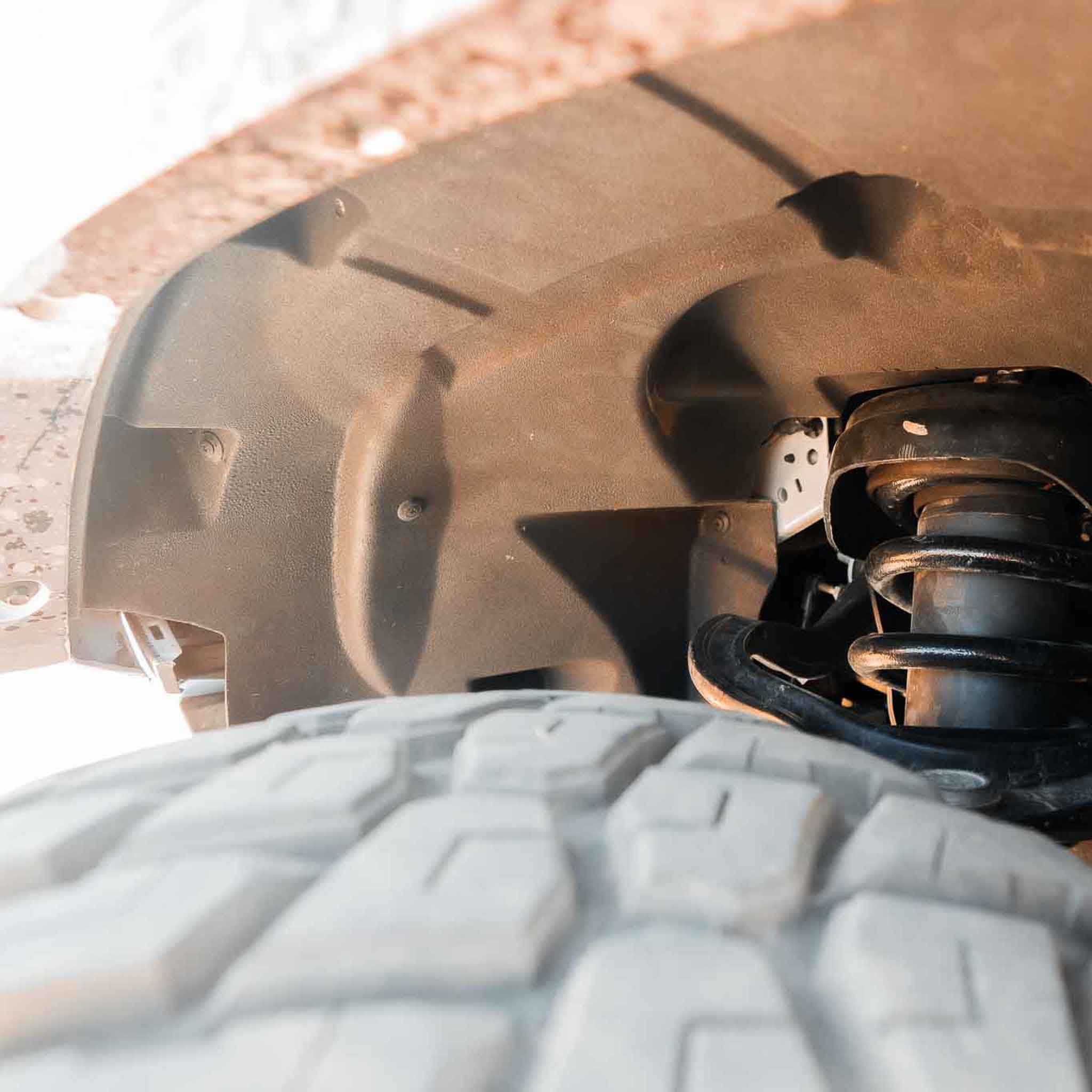 2022-2025 Ford Bronco Raptor fenders showcasing interior design and tire clearance for enhanced offroad performance.