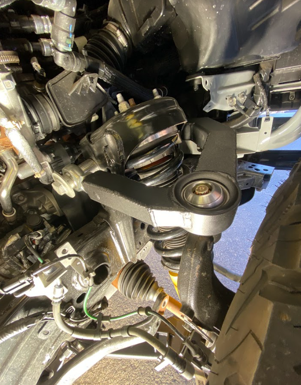 2021 and up Bronco fabricated upper arm kit installed, showcasing stock length components and suspension details.