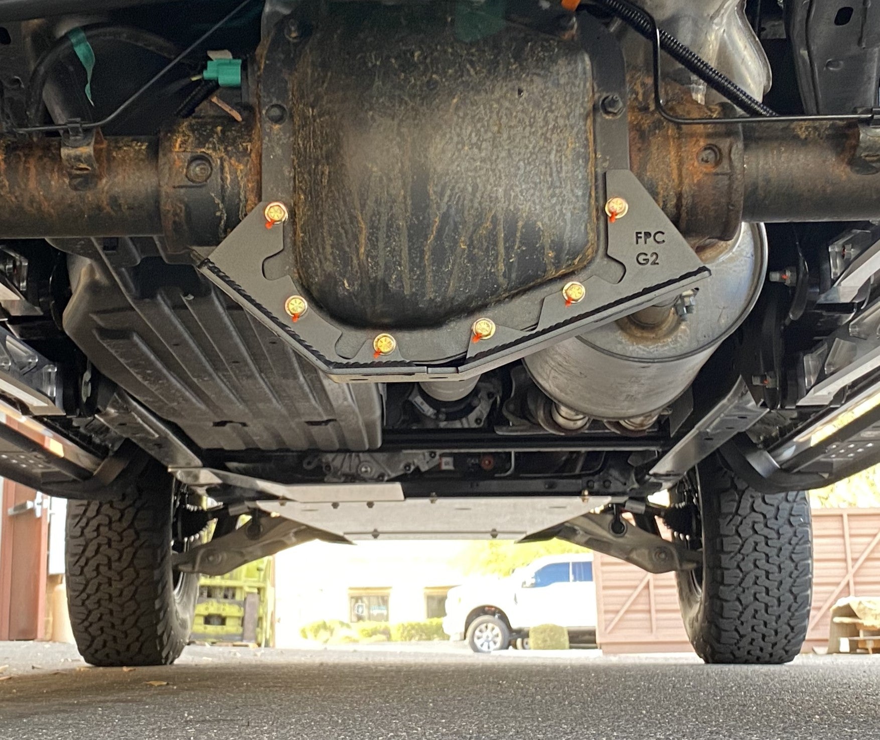 Rear view of a 2017-2024 Raptor with a differential skid plate kit installed, showcasing durability and protection for offroad use.