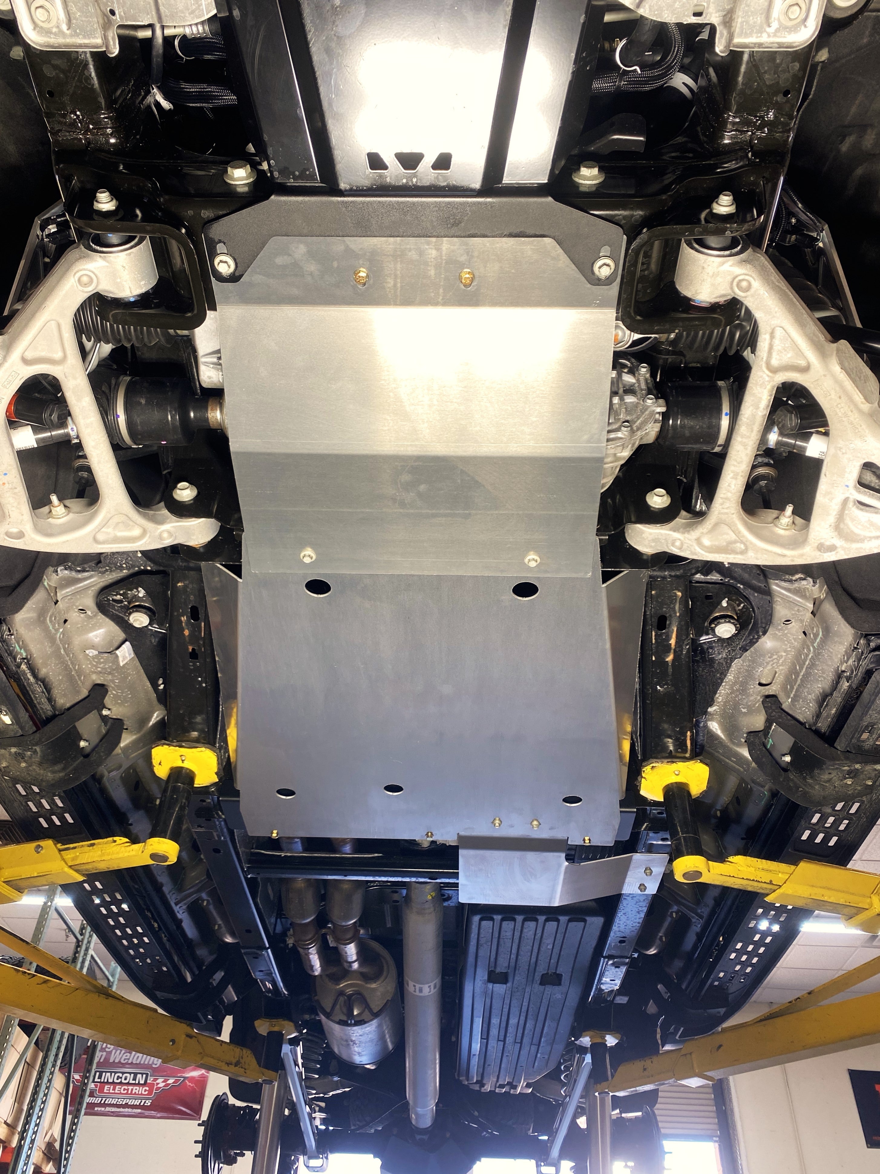 Skid plate kit installed on a 2017-2024 Ford Raptor, showcasing undercarriage protection and durability features.