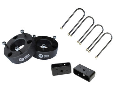 3-inch front strut spacers and 2-inch rear lift blocks with U-bolts for enhanced offroad vehicle suspension.