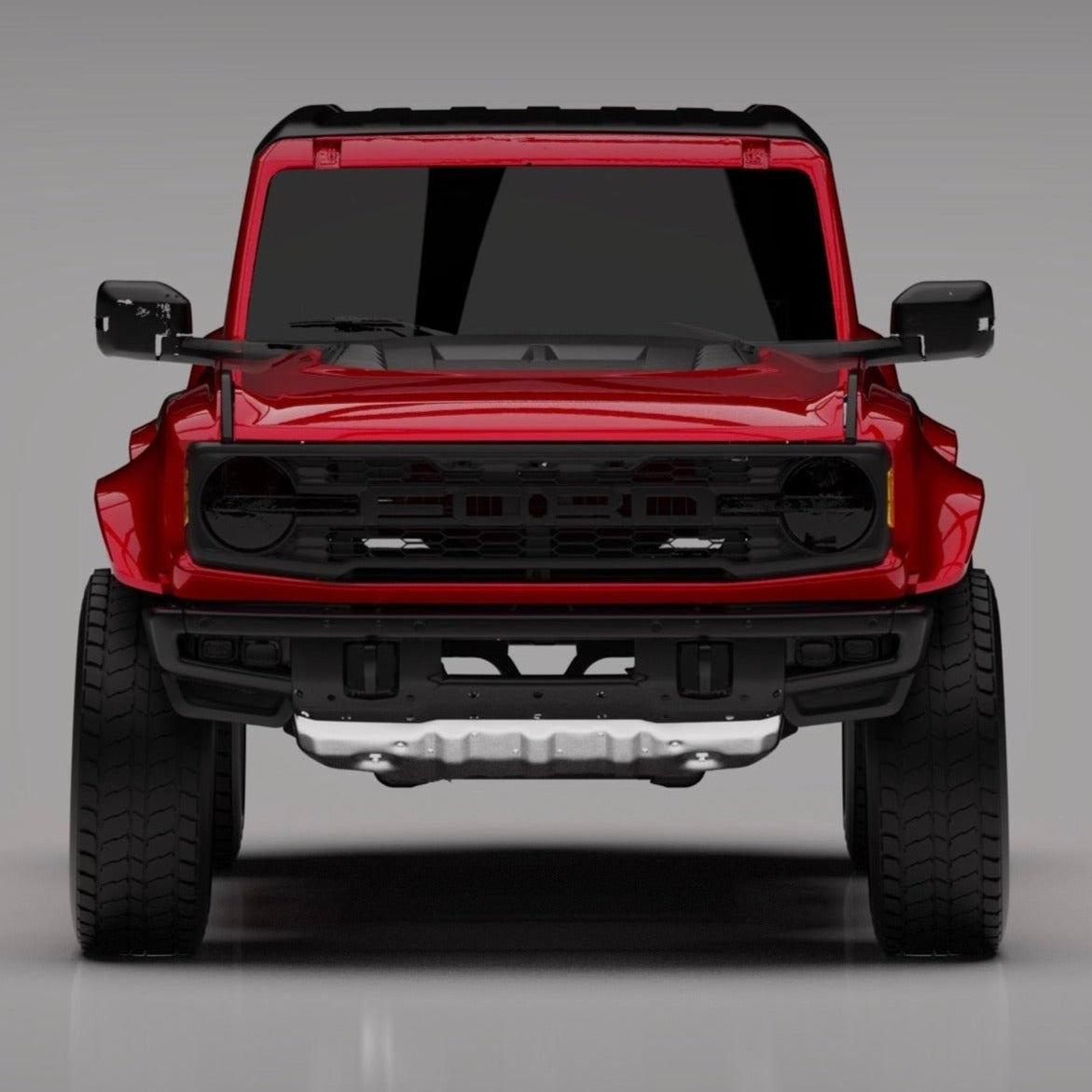 Front view of a red 2022-2025 Ford Bronco Raptor showcasing aftermarket fenders designed for enhanced off-road performance.