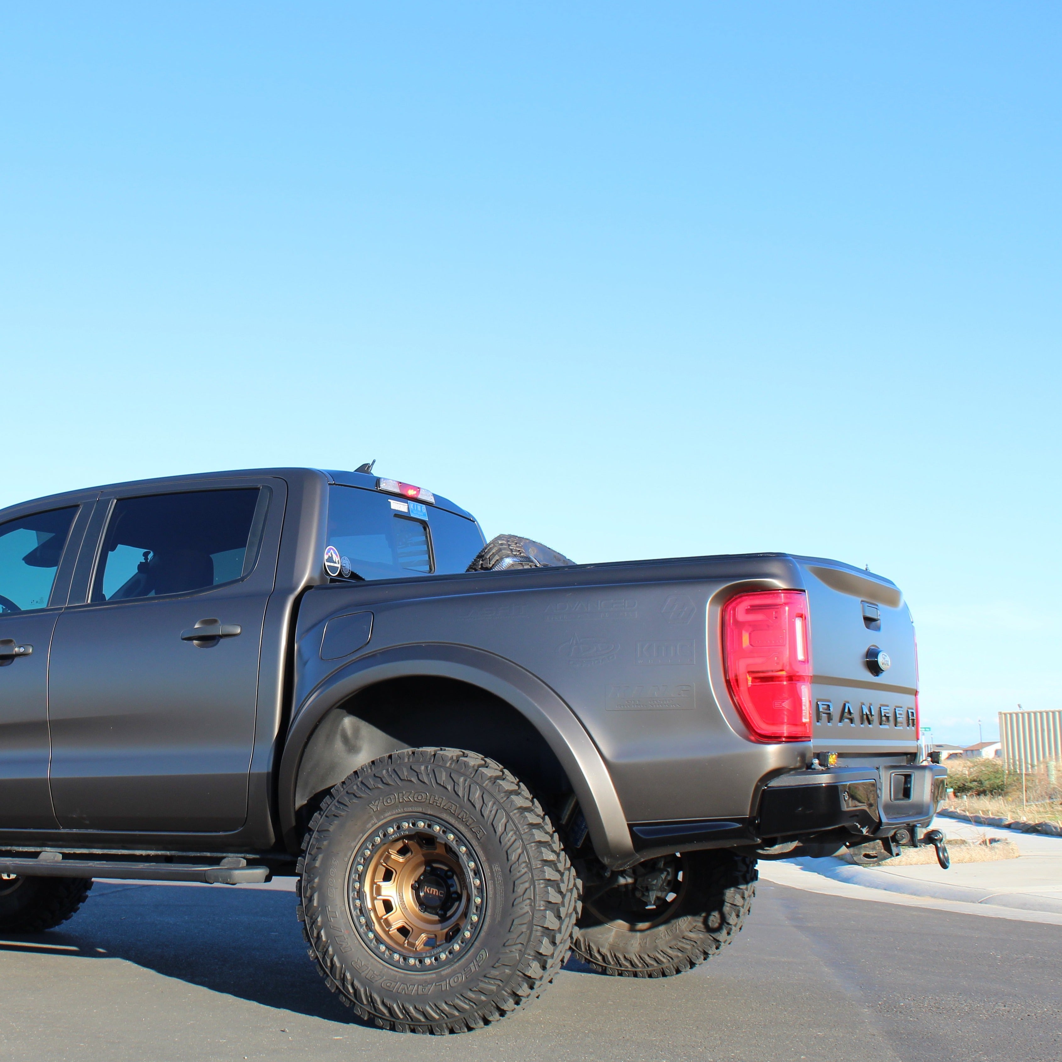 2019-2023 Ford Ranger with custom bedsides showcasing rugged offroad capabilities and a sleek matte finish.